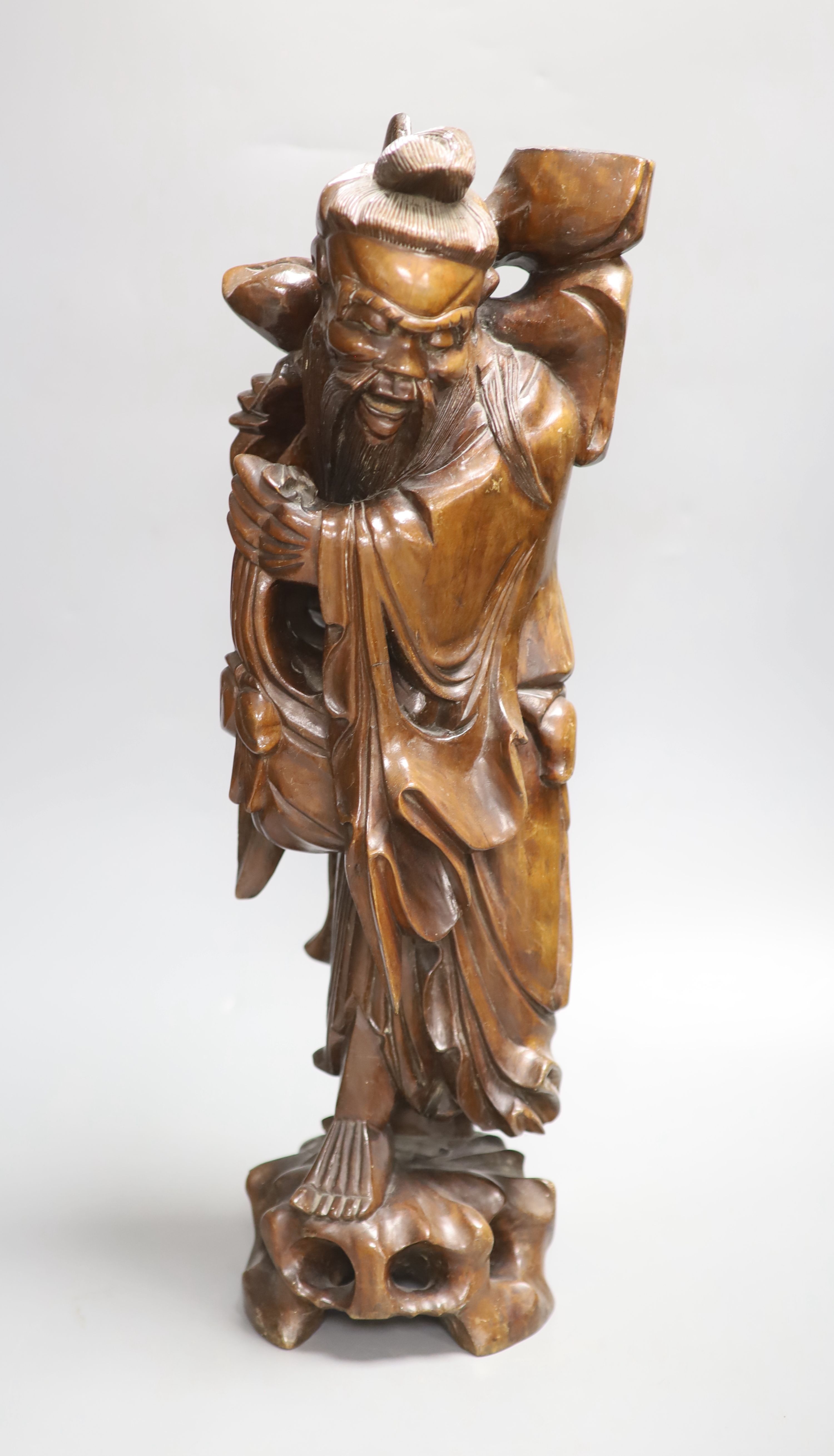 A Chinese hardwood carving of Shou, height 54cm